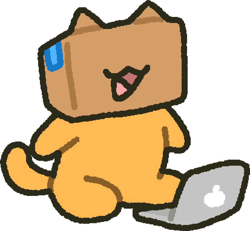 BOXY sitting beside an open laptop.